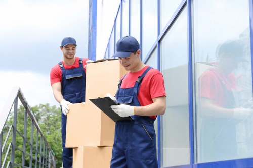 Professional movers handling furniture in Barnes Storage
